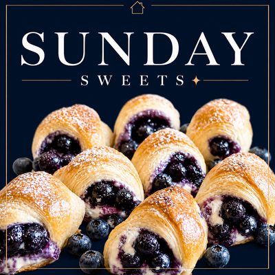Blueberry cream cheese crescent rolls dusted with powdered sugar and filled with sweet blueberries.