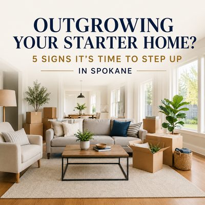 Living room with moving boxes and furniture representing a growing family upgrading from a starter home to a larger house in Spokane, Washington.